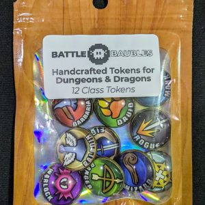 Package of ‘BATTLE BAUBLES Handcrafted Tokens for Dungeons & Dragons,’ featuring 12 colorful class tokens. Each token displays a unique symbol representing different D&D classes, such as a shield, an axe, and a spellbook. The packaging includes a clear plastic cover with a cardboard top displaying the product name and a pixelated image of a shield and crossed swords.